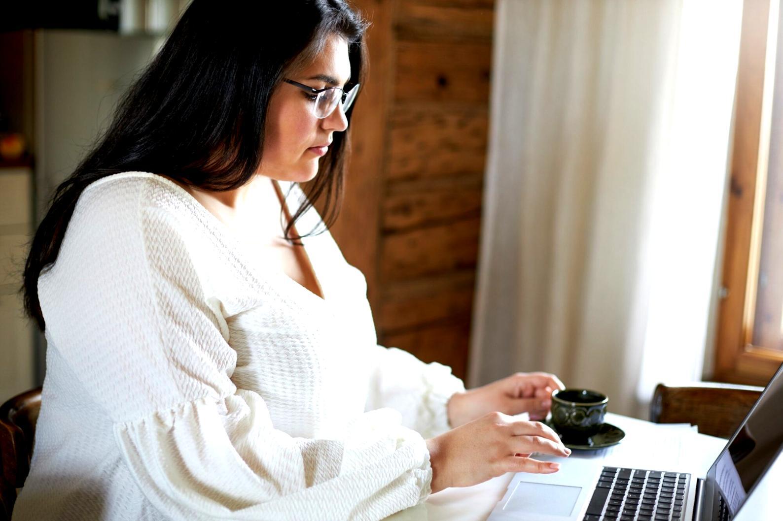 Person reviewing investment documents and planning financial strategy